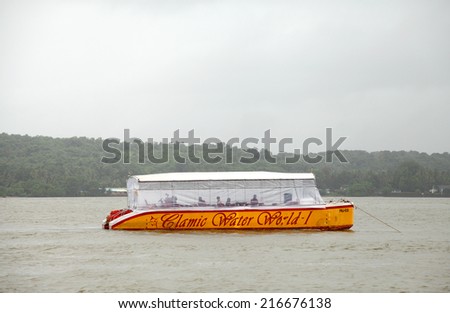 GOA, INDIA- AUGUST 10: The small boat taking tourist round the Mandovi river with music and dance on August 10, 2014, Goa
