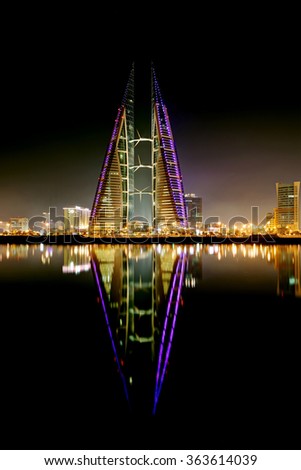 MANAMA, BAHRAIN - JANUARY 15: Bahrain World Trade Center at night, a twin tower complex is the first skyscraper in the world to have wind turbines, photographed on January 15, 2016, Manama, Bahrain