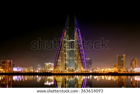 MANAMA, BAHRAIN - JANUARY 15: Bahrain World Trade Center at night, a twin tower complex is the first skyscraper in the world to have wind turbines, photographed on January 15, 2016, Manama, Bahrain