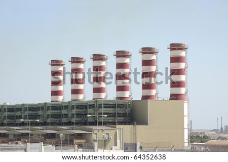Power plant chimneys in Bahrain with almost no greenhouse gases
