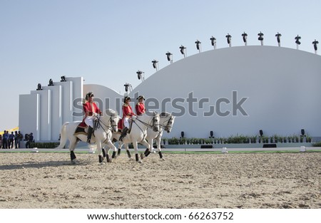 SAKHIR, BAHRAIN - NOVEMBER 26: The Lipizzaner Stallions performs on November 26, 2010 in Bahrain International Endurance Village, Sakhir during the Bahrain Animal Production Show 2010