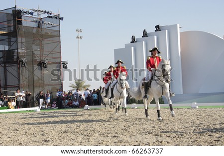 SAKHIR, BAHRAIN - NOVEMBER 26: The Lipizzaner Stallions performs on November 26, 2010 in Bahrain International Endurance Village, Sakhir during the Bahrain Animal Production Show 2010