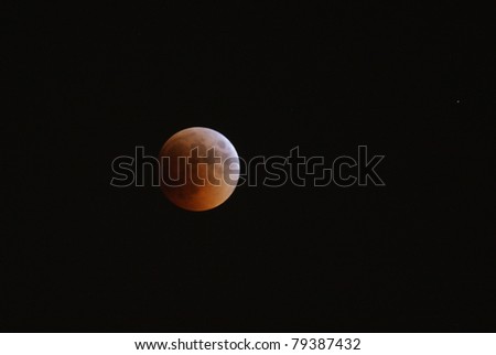 MANAMA, BAHRAIN - APRIL 15-16: Longest lunar eclipse of decade with partial, total and mid eclipse phases observed on June 15-16, 2011 in the sky of Manama, Bahrain. Total eclipse 15 June at 22:24