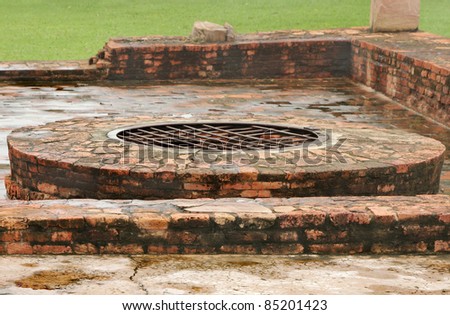 Close view of ancient well at monastery ruins site, Sarnath
