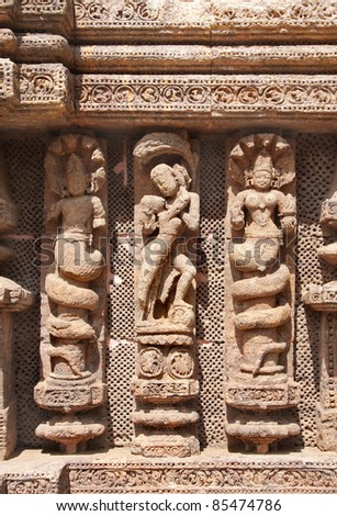 A loving couple and snake hooded women sculptures, Sun temple, Konark