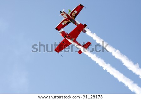 MUHARRAQ, BAHRAIN - DECEMBER 16: Stunts pilots from The Champions Aerobatic Show (TCAS) perform on December 16, 2011 on the occasion of Bahrain 40th National Day at Busaiteen beach in Muharraq, Bahrain
