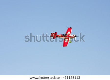 MUHARRAQ, BAHRAIN - DECEMBER 16: Stunts pilots from The Champions Aerobatic Show (TCAS) perform on December 16, 2011 on the occasion of Bahrain 40th National Day at Busaiteen beach in Muharraq, Bahrain