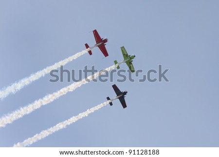 MUHARRAQ, BAHRAIN - DECEMBER 17: Stunts pilots from The Champions Aerobatic Show (TCAS) perform on December 17, 2011 on the occasion of Bahrain 40th National Day at Busaiteen beach in Muharraq, Bahrain