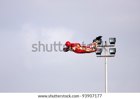 SAKHIR AIRBASE, BAHRAIN - JANUARY 21: A person showing acrobatic on Aerodium, a vertical wind tunnel at the venue  of Bahrain International Airshow at Sakhir Airbase, Bahrain on 21 January, 2012