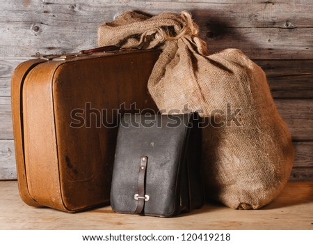 Luggage - ancient suitcase, leather bag and jute burlap