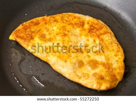 Chebureck - a fried pie with mince from meat of mutton