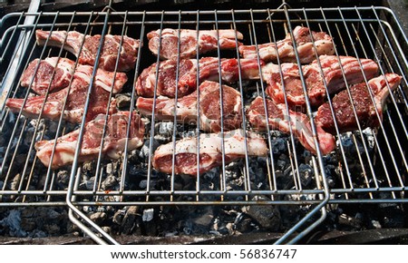 Raw mutton chops on a grill