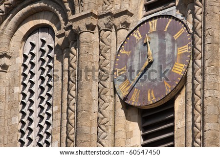The old clock on the outside of Winchester cathedral