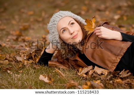 young girl in autumn park