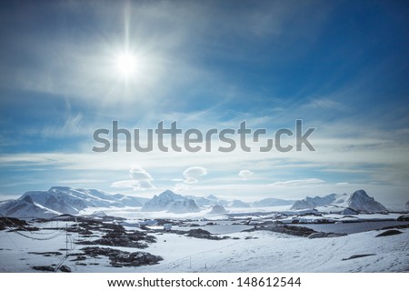 Beautiful Snow-Capped Mountains Against The Blue Sky In Antarctica