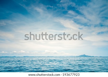Blue sunny sea and cloudy blue sky