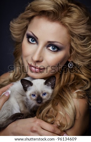 stock photo Portrait of a young sexy girl with kitten