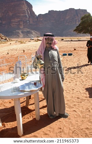 Wadi Rum, Jordan: Jan. 7, 2009:  A Bedouin man stands ready to serve tea to passing visitors at Wadi Rum, a favorite tourist destination also known as The Valley of the Moon.