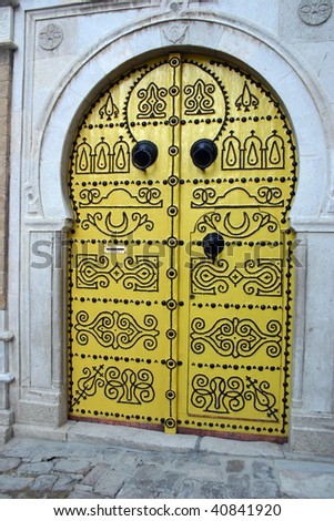 Ornate Yellow nailed doors in the outside the medina in Tunis