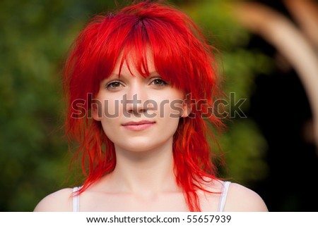 Portrait of redhead woman looking at camera