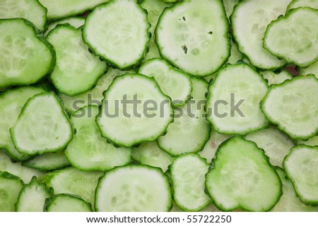 Background of peaces of green cucumber