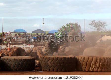 MAUI, HAWAII-DEC 9: Rock crawler vehicle driver Phil Hooper fights the dust as he takes second place at Maui Motorsports Park on December 9, 2012 in Maui, Hawaii.
