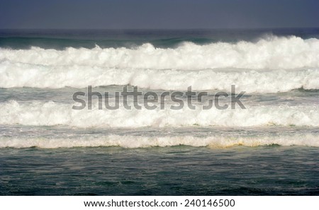 Heavy winter surf rolls in to the beach on the northshore of the island of Maui, Hawaii.