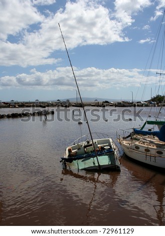 MAUI, HAWAII-MAR 11: Tsunami from Japanese earthquake causes severe damage to Maalea Harbor and to a small craft on March 11, 2011 in Maui, Hawaii.