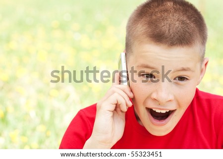 The boy speaks by phone
