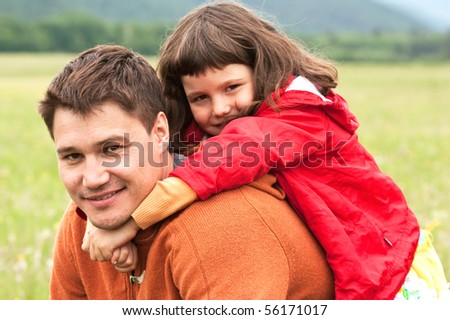 The father with the daughter on the nature