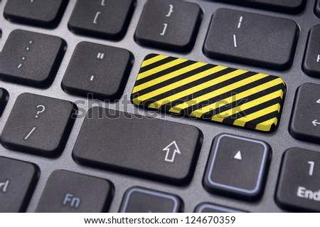 yellow and black stripes on enter key of keyboard, for restricted websites of internet.