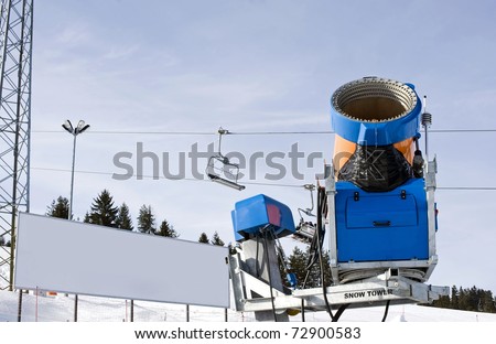 Snow making machine with blank billboard in the background, you can place your own text.