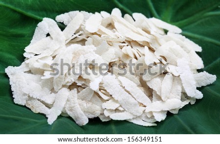 Flattened rice of South East Asia on green leaf