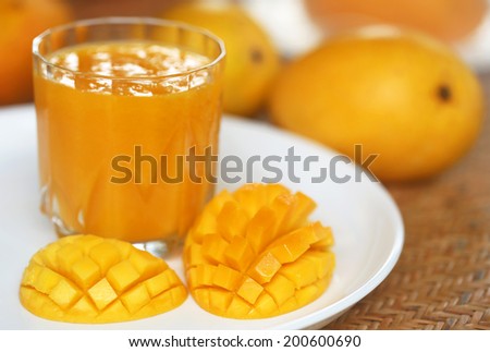 Mango juice with sliced  and whole fruits
