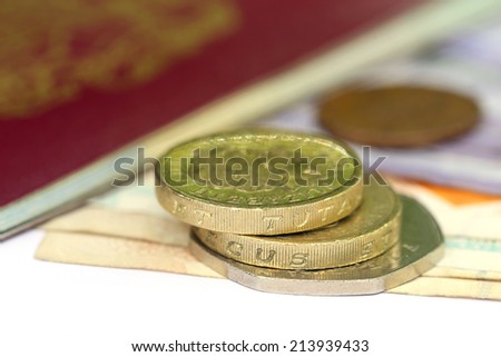 British Pound with bank notes with passport
