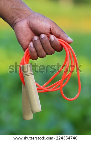 Hand holding a skipping rope