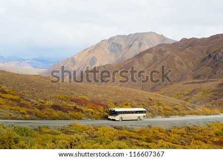 View of a tour bus taken from Polychrome Pass in Denali National Park, Alaska