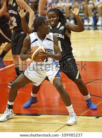 FREDERICTON, CANADA - AUGUST 11: Quebec\'s Tamara Fruquhar competes against Manitoba in the Canadian 15U girls basketball championship game August 11, 2012 in Fredericton, Canada. Quebec won 77-56.