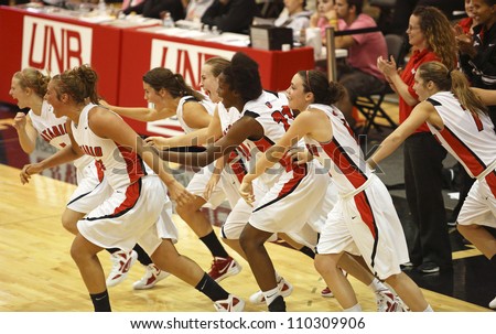 FREDERICTON, CANADA - AUGUST 11: Ontario celebrates after defeating Nova Scotia 66-48 in the Canadian 17U women\'s basketball championship game August 11, 2012 in Fredericton, Canada.