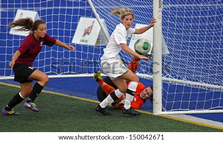 SHERBROOKE, CANADA - August 7: New Brunswick\'s Alex Maltais and Prince Edward Island\'s Clare Casey and Nicole McInnis compete in women\'s soccer at the Canada Games Aug. 7, 2013 in Sherbrooke, Canada.