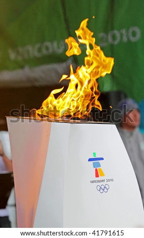 SUSSEX, NB - NOVEMBER 24: The Olympic flame lights the community cauldron as part of the cross-Canada torch relay on November 24, 2009 in Sussex, New Brunswick, Canada.