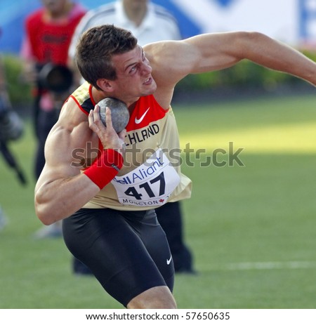 MONCTON, CANADA - JULY 21: Marcel Bosler of Germany performs the men\'s shot put (six kg) at the 2010 IAAF World Junior Championships on July 21, 2010 in Moncton, Canada.