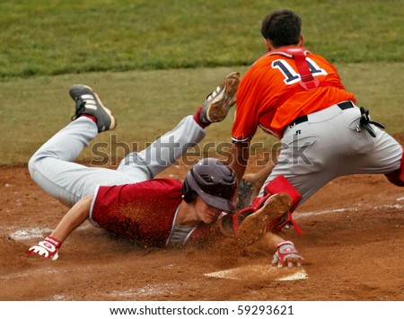 BANGOR, MAINE - AUGUST 16: Maine's Wyatt Frost slides safely into home against Alessandro Grimaudo of Italy at the 2010 Senior League Baseball World Series on August 16, 2010 in Bangor, Maine.