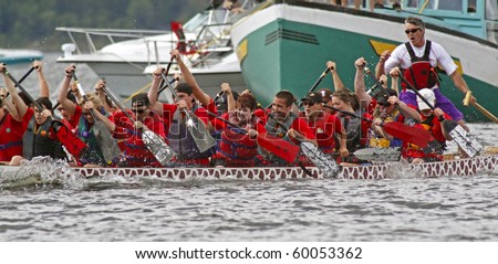 SAINT JOHN, CANADA - AUGUST 28: A team competes at the Saint John Dragon Boat Festival, a fundraiser of St. Joseph\'s Hospital Foundation, on August 28, 2010 in Saint John, Canada.