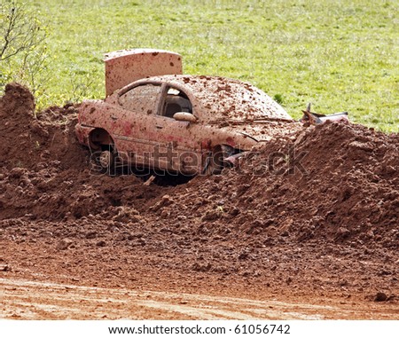 NORTON, CANADA - SEPTEMBER 11: A junked car forms part of the bank at a demolition derby on September 11, 2010 in Norton, Canada.