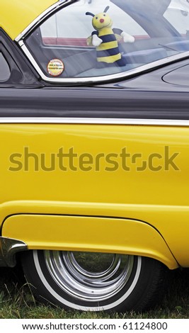 SUSSEX, CANADA - SEPTEMBER 12: A yellow and black car with a doll in the window at a show and shine as part of the 2010 Atlantic International Balloon Fiesta on September 12, 2010 in Sussex, Canada.