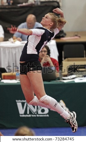 SAINT JOHN, CANADA - MARCH 12: Mount Royal\'s Andrea Price jumps for a hit at the Canadian Colleges Athletic Association women\'s volleyball national championship March 12, 2011 in Saint John, Canada.