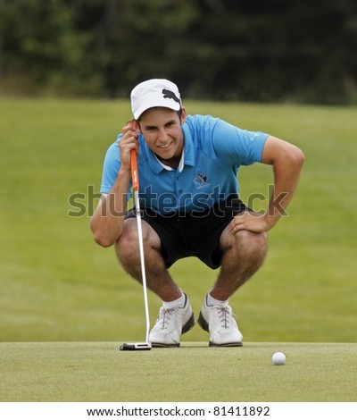 SUSSEX, CANADA - JULY 21: Chad MacMillan of Kingston, NS, studies his putt at the CN Future Links Atlantic Championship on July 21, 2011 in Sussex, Canada.