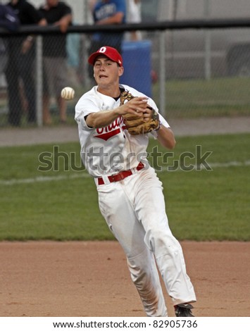 MONCTON, CANADA - AUGUST 14: Ontario shortstop Mitchell Triolo throws to first against Saskatchewan at the 2011 Baseball Canada Cup on August 14, 2011 in Moncton, Canada.
