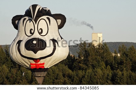 SUSSEX, CANADA - SEPTEMBER 8: Pepe the Skunk hot air balloon lands near PotashCorp in Penobsquis at the Atlantic International Balloon Fiesta on September 8, 2011 in Sussex, Canada.